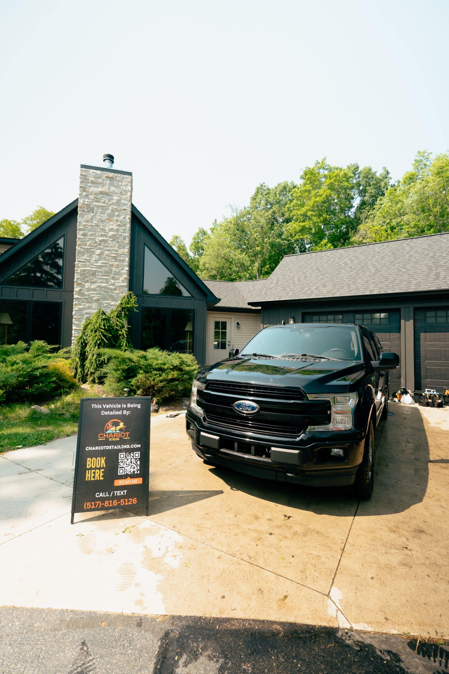 Black SUV parked outside after mobile detailing service
