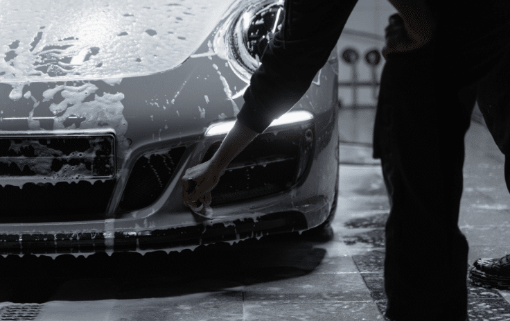 Front bumper and wheel cleaned during exterior detailing process